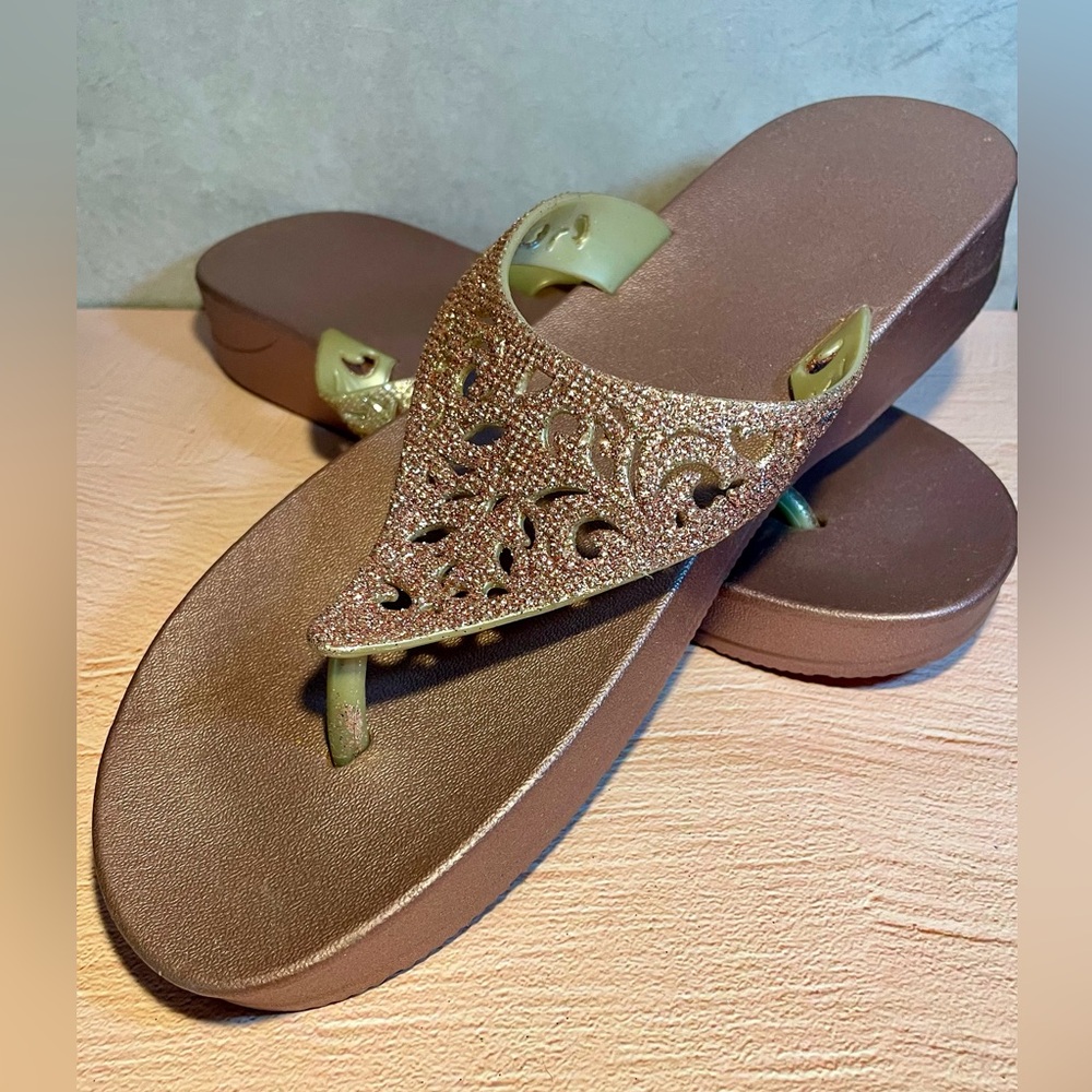 Rose gold sparkly sandals.